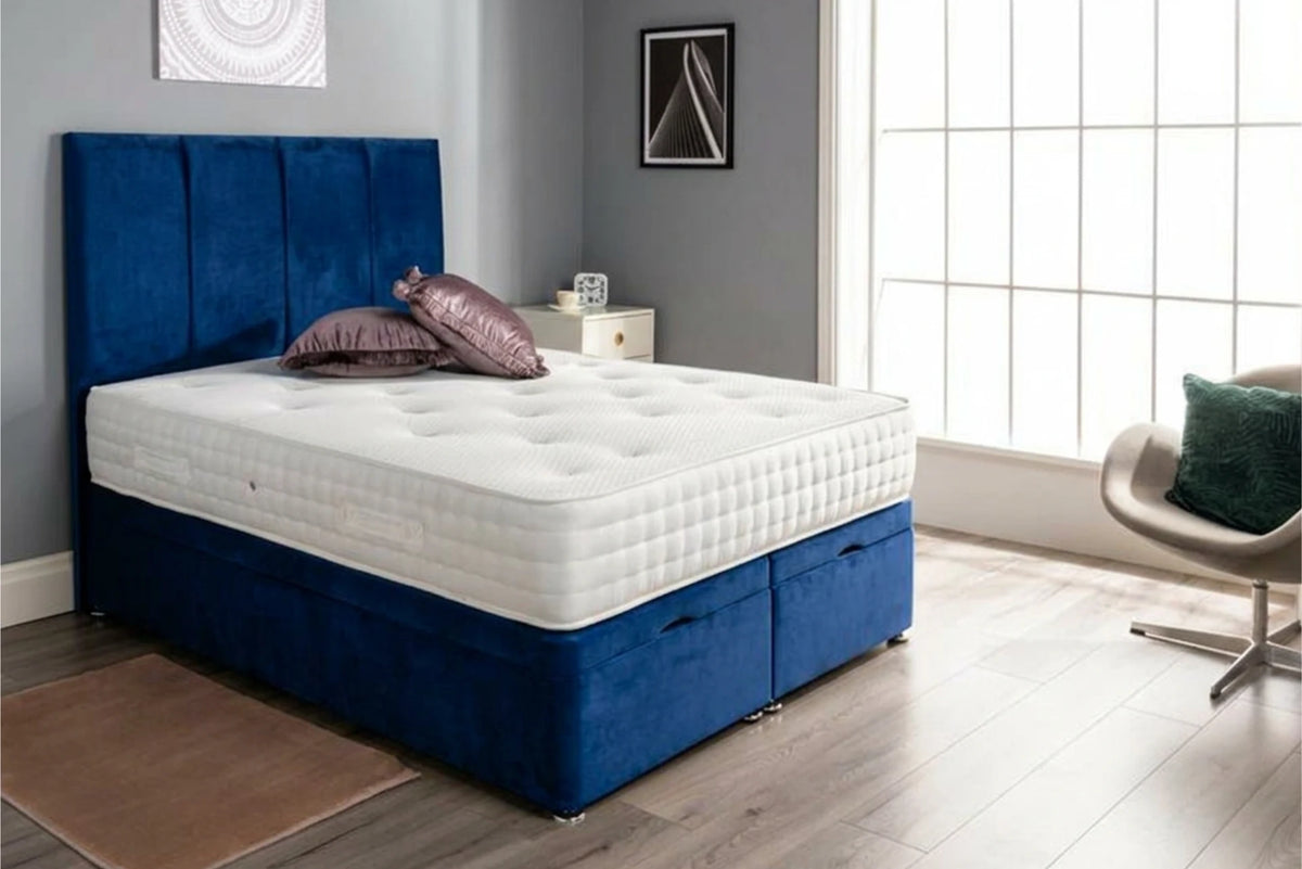 Ottoman end lift storage bed in plush marine blue with tall headboard and mattress